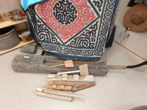 A group of wood objects on the floor

AI-generated content may be incorrect.