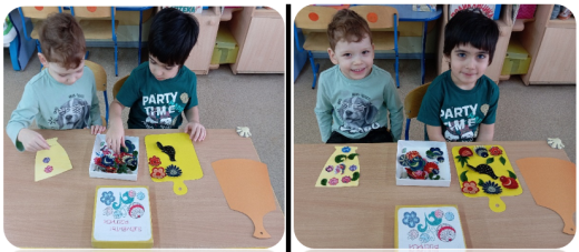 Выкладывание на шаблоне элементов и украшений городецкой росписи