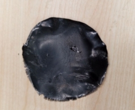 Высушенный раствор черного вспененного полистирола в лимонене